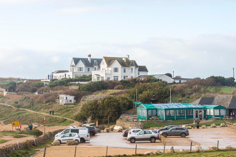 The mansion, in Dorset, has five bedrooms, a boot room, coat room, cloakroom, study, drawing room, dining room, an indoor swimming pool and a balcony offering stunning sea views