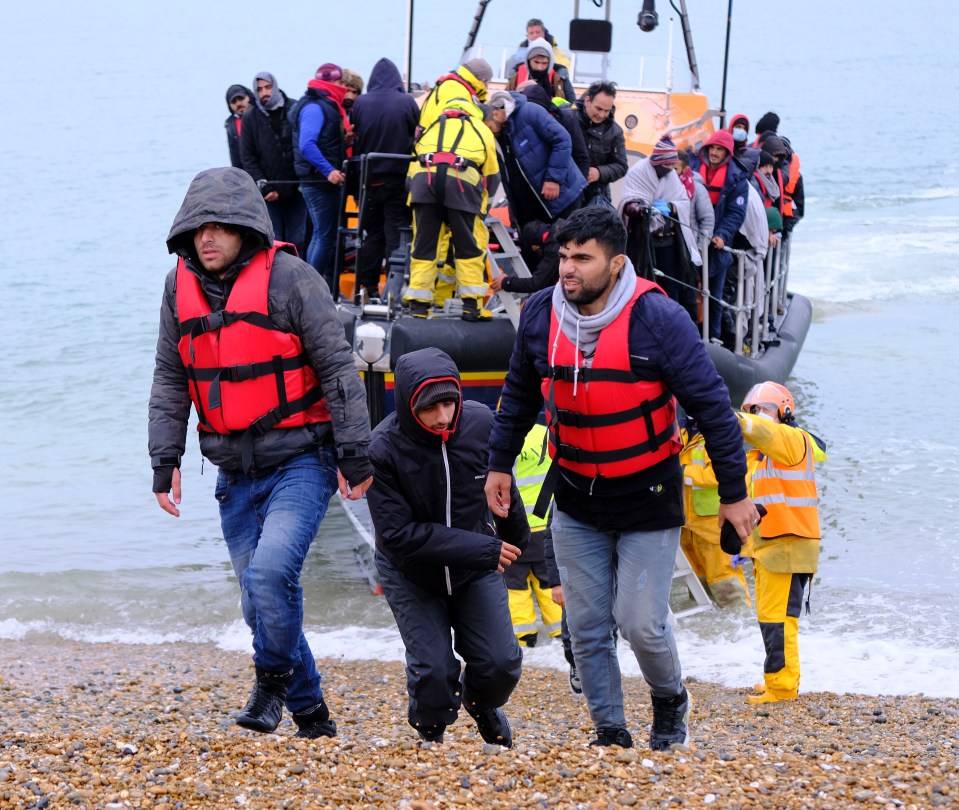 A lifeboat with 39 migrants arrives on shore yesterday