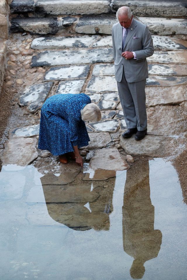 Prince Charles and the Duchess of Cornwall were yesterday afforded the honour of dipping their fingers in the holy water