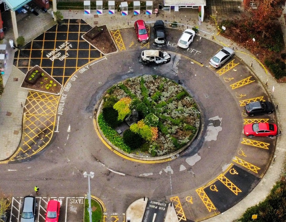 Aerial shots show the charred taxi outside the hospital