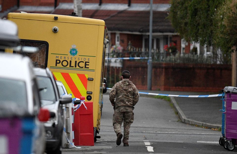 The bomb squad found 'several suspicious packages' after raiding the pub and asylum hostel