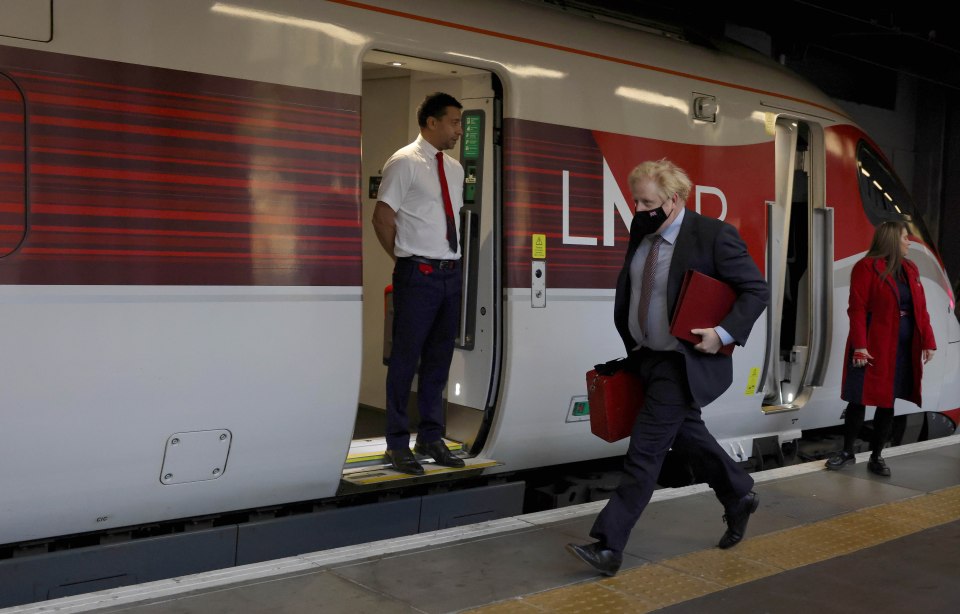 Boris Johnson was snapped running for a train this morning