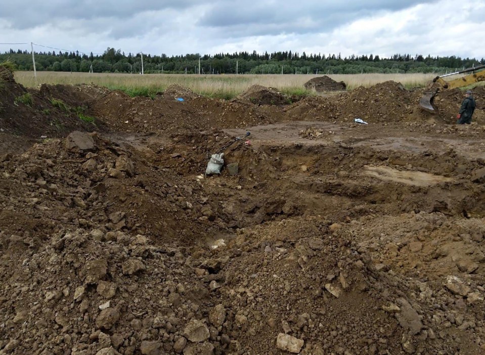 Search teams have unearthed 1,362 bodies from the mass grave in the Lomonosovsky district of western Russia