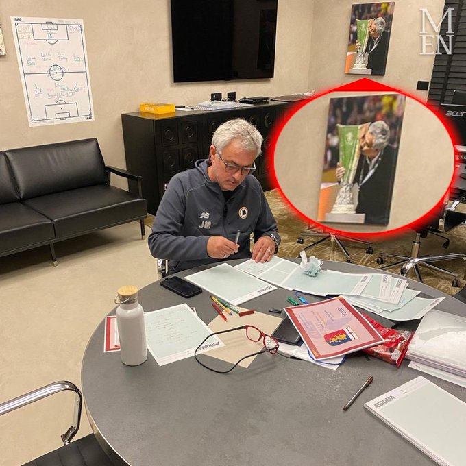 Jose Mourinho has a picture of himself kissing the Europa League trophy hanging in his office