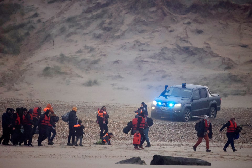 French police were nearby as migrants prepared to make the journey across the water