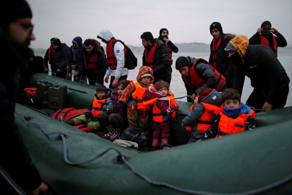 Migrants come ashore in Kent safely after crossing rough seas in the Channel