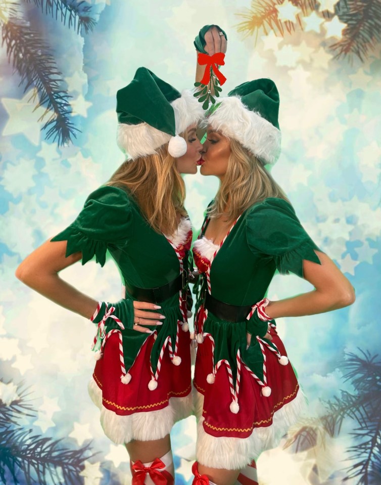 Radio presenters Amanda Holden and Ashley Roberts are both naughty and nice as they share a cheeky Christmas smooch underneath the mistletoe