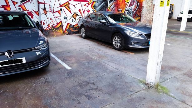 The dad parked his car slightly into the neighbouring bay - which he claims was blocked off with a pillar