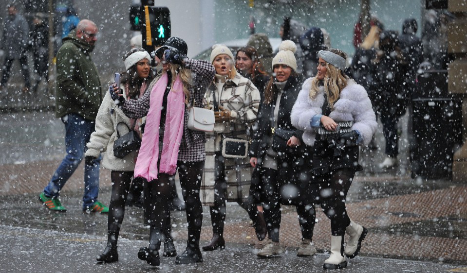 Shoppers in the snow in Manchester