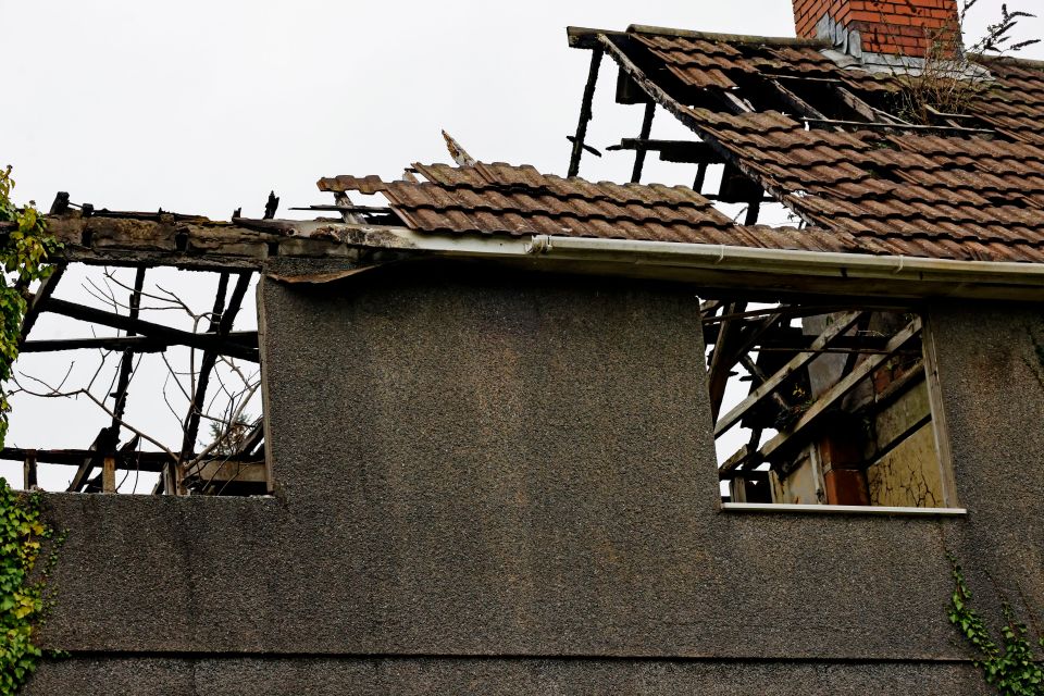 Carcasses of homes are rotting, with roofs collapsing and window's smashed