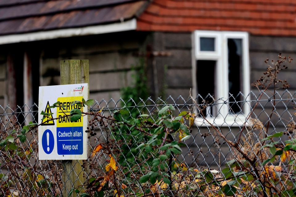 The streets are fenced off in places and have piles of discarded rubbish