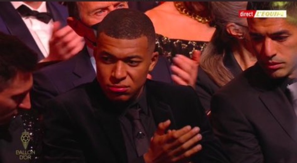 Kylian Mbappe, 22, did not look impressed at finishing NINTH at the 2021 Ballon d'Or ceremony