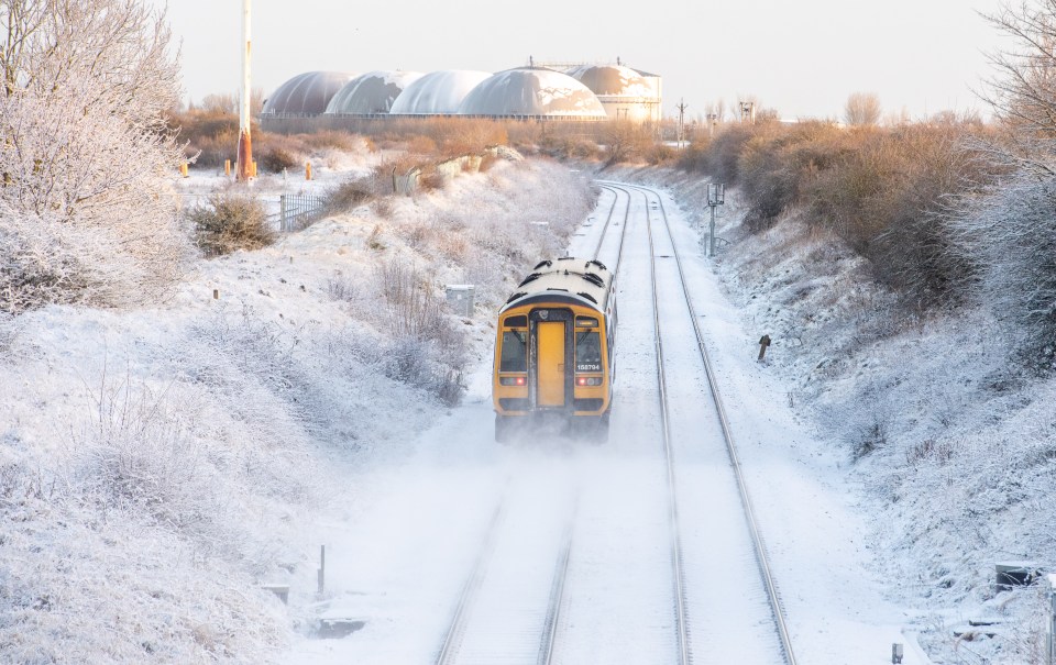  A Northern Rail train battles the wintery conditions with Snow and Ice in Greatham Village as Teesside has been hit with up-to 5cm of snow