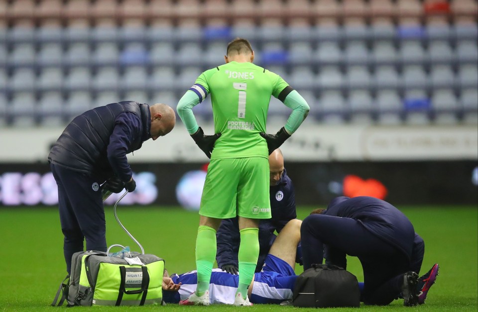 Jamie Carragher's son James had to be carried off on a stretcher as Wigan beat Shrewsbury