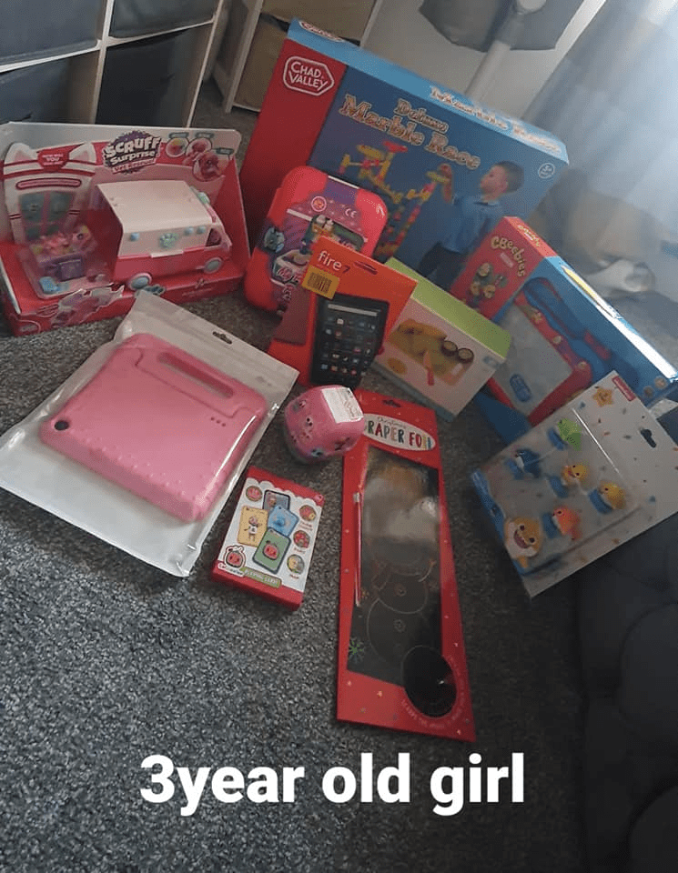 Both her daughters have a new tablet and a selection of toys