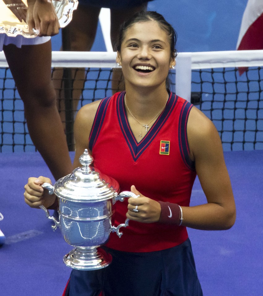 Emma Raducanu poses with the US Open trophy after her stunning victory in New York