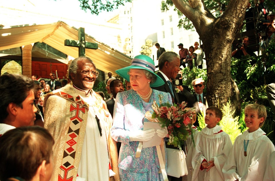 Desmond Tutu pictured with the Queen and Nelson Mandela in 1995 leaving a service that marked human rights day