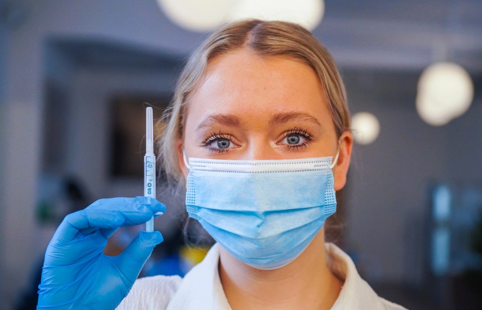 Iona, an NHS staff nurse, with a Covid booster shot at a vaccine clinic at the Falmouth Town Council offices, December 20