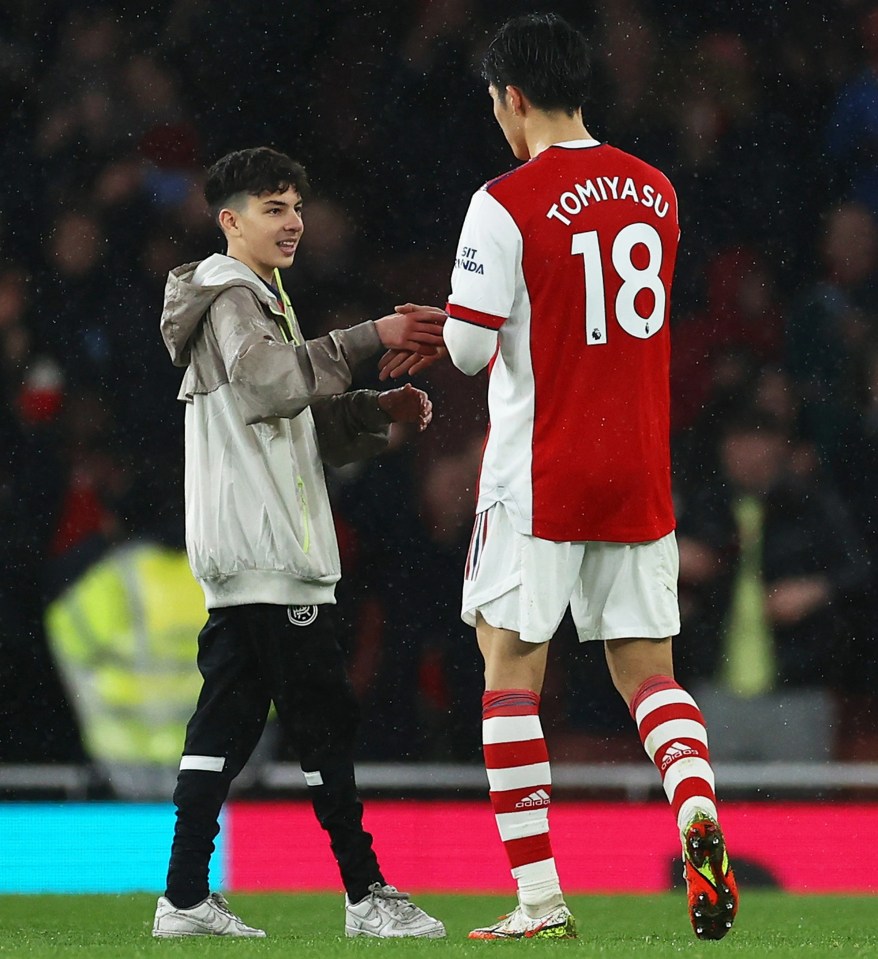 Arsenal's Japan defender Takehiro Tomiyasu greeted the young fan on the Emirates pitch and handed over his shirt