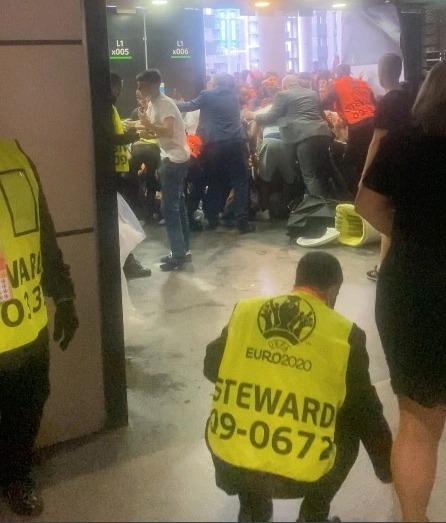 Yobs attempt to get through a door meant for disabled access at Wembley Stadium