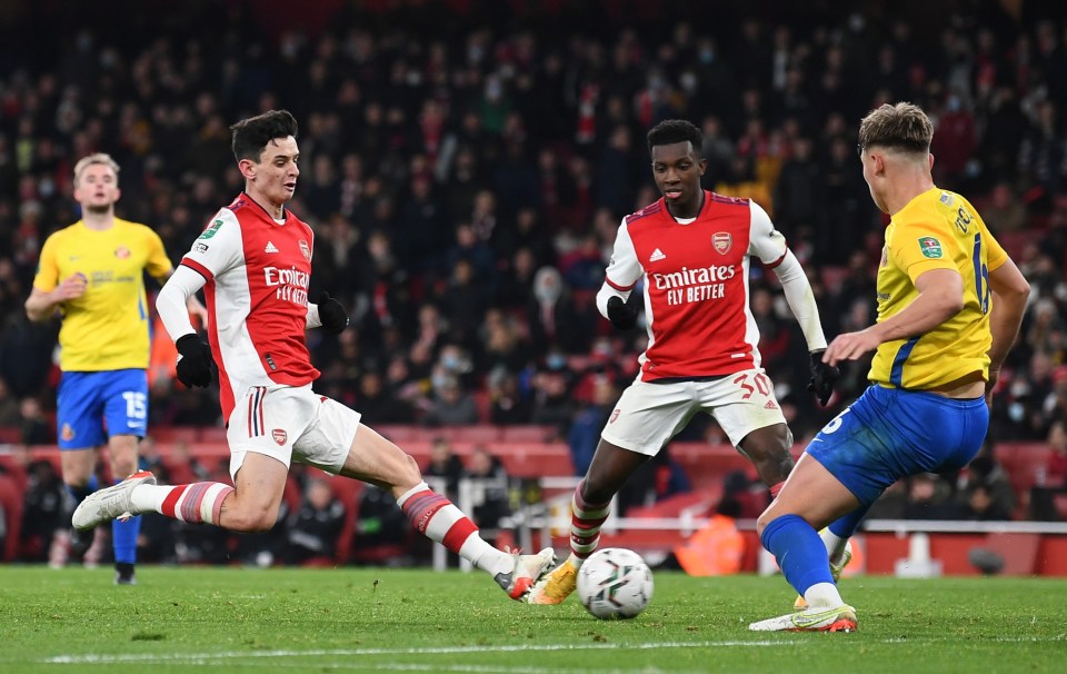 Charlie Patino slides in a goal against Sunderland on his first team debut