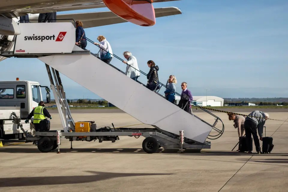 If you have your bag directly above you, you can be off the plane quickly