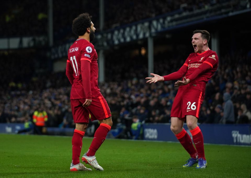 Salah celebrates with Andy Robertson after sealing the win with his second goal