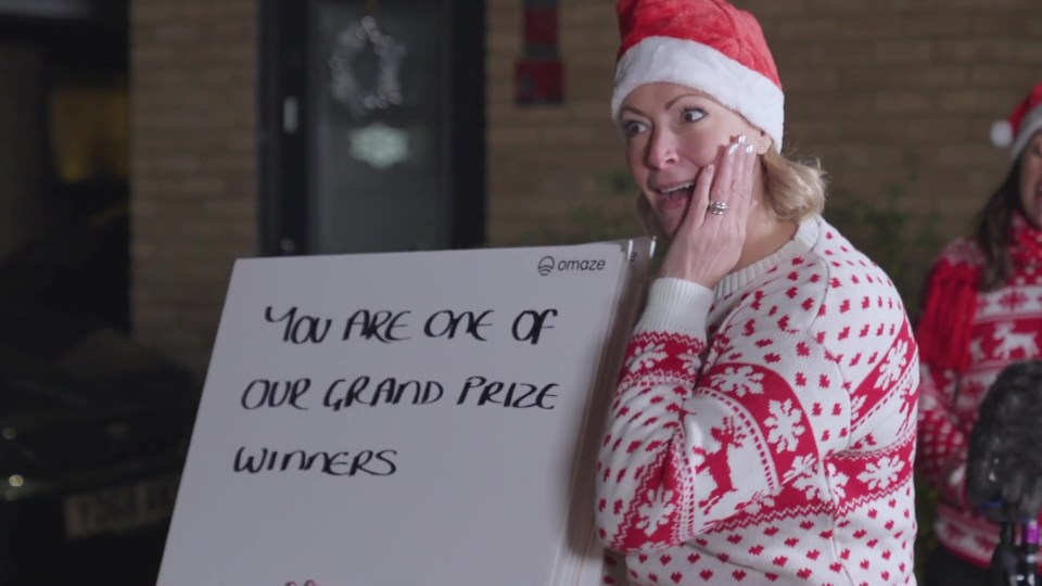 Carol singers and messages on big cards revealed they had scooped the main prize