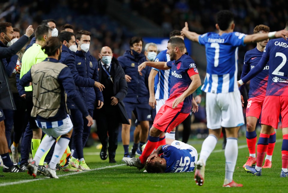 Atletico Yannick Carrasco flicked out at Porto’s Otavio as their clash descended into chaos