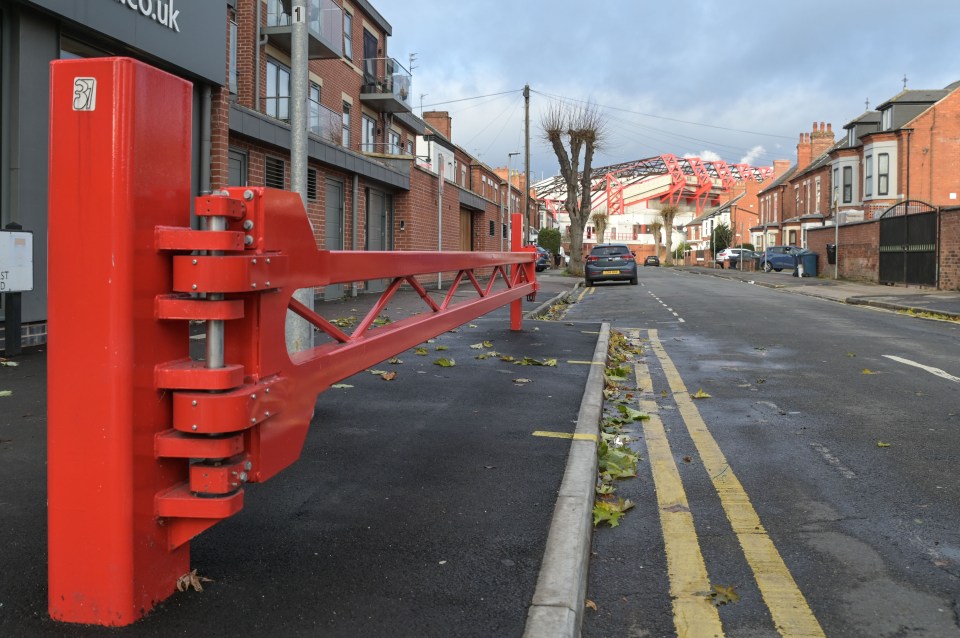 The gates are bright red and match the stadium ground