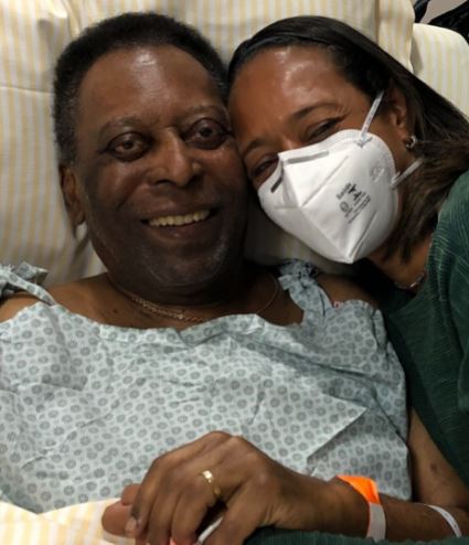 Pele smiled next to his daughter after undergoing further treatment on a colon tumour - but his family have called it 'scheduled' treatment