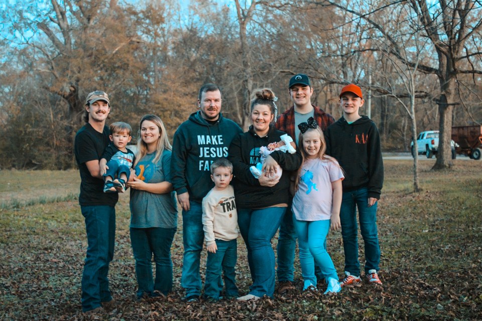 From left-right, Samantha's husband Blake, 27; Samantha's son Johnie, two and a half; Samantha, 23; Felicia's husband Michael, 35; Brentley, five; Felicia, 35; Samantha's daughter Bristol, one month; William, 15; Harleigh, 10; and Kenlan, 13 (all Felicia's kids unless otherwise referenced)