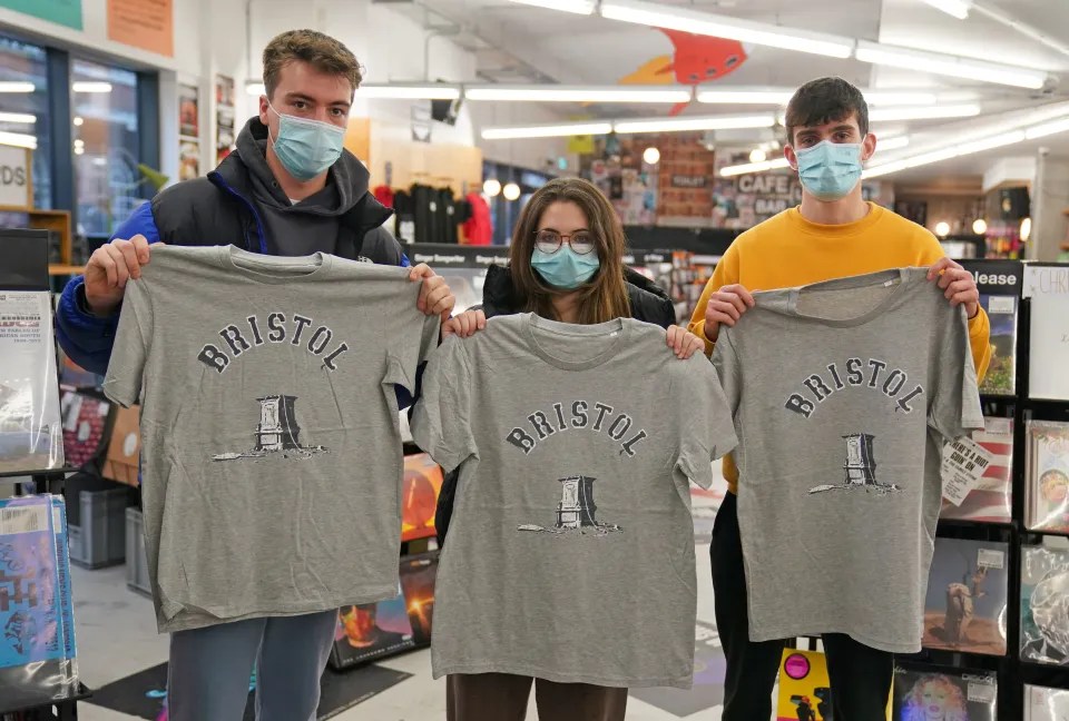 Customers in Rough Trade, Bristol, with T-shirts designed by street artist Banksy