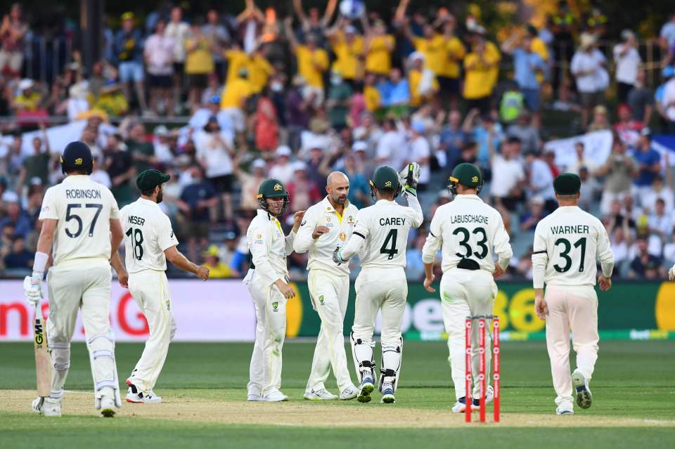 Nathan Lyon celebrates bowling Ollie Robinson out