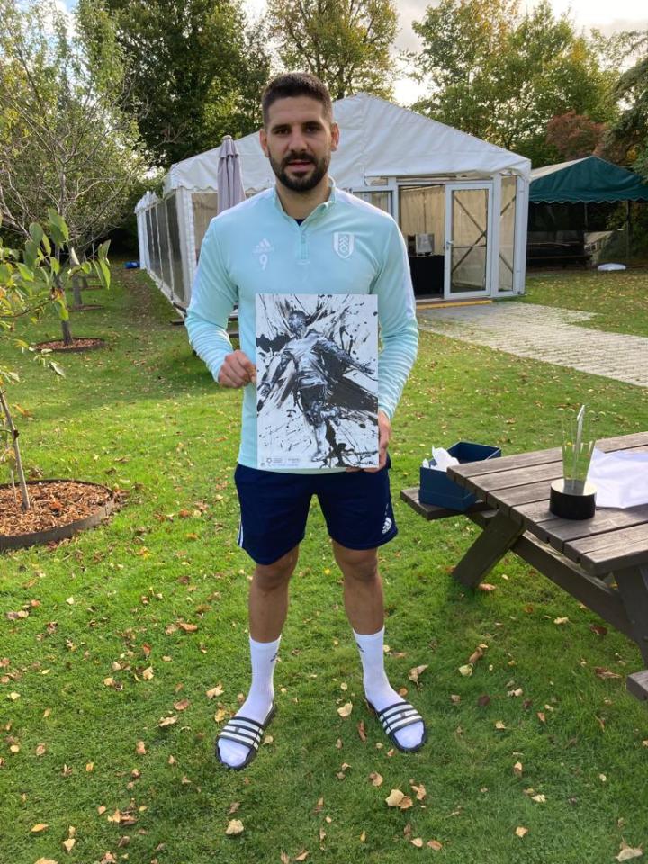 Mitrovic with one of Roman's paintings