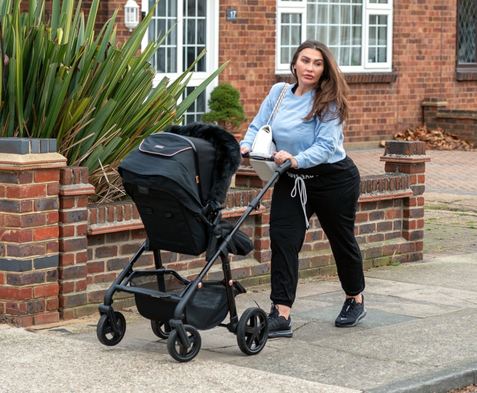 Lauren Goodger takes her baby girl out for a stroll after their Covid battle