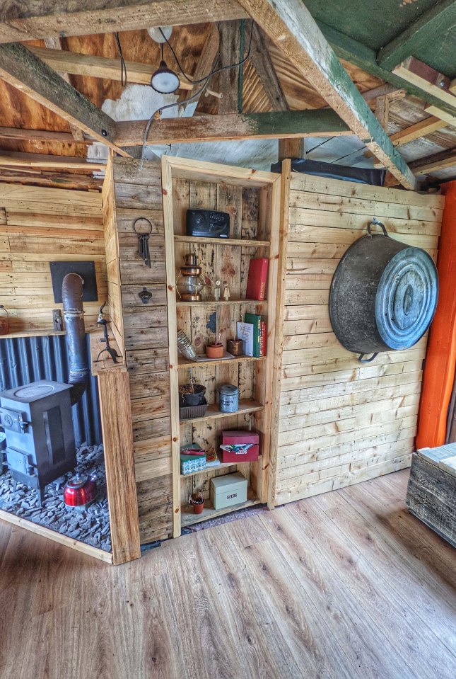 The ultimate man cave complete with a DIY, concealed door disguised as a bookcase hiding the bathroom