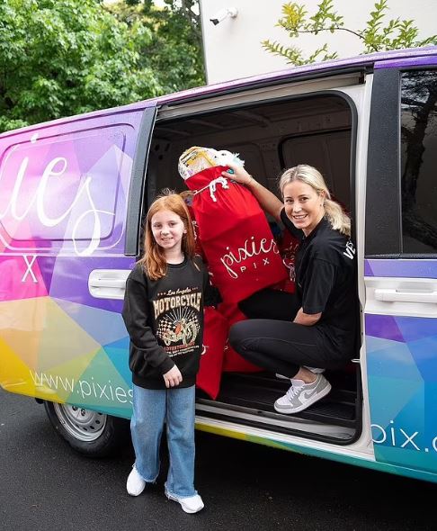 Girl donating toys to charity.