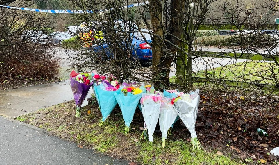 Mourners laid floral tributes at the scene