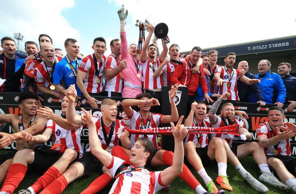 Lincoln City celebrate promotion back to the EFL after winning the National League