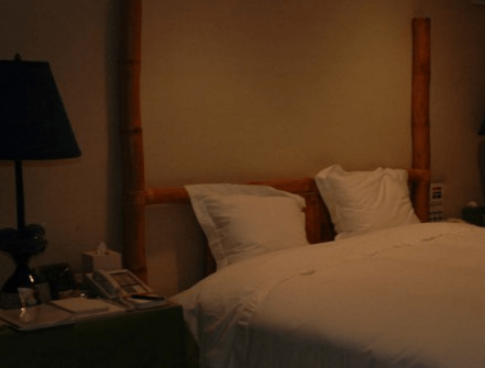 Boxes of tissues are seen sat next to a large bed at the mansion in Palm Beach