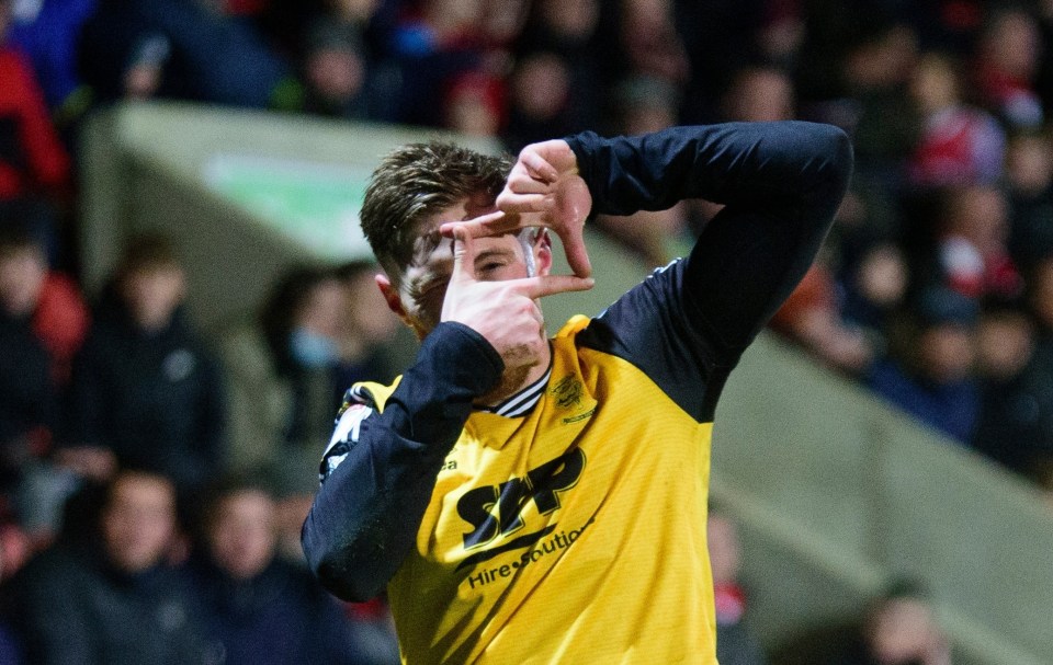 Teddy Bishop celebrates scoring for Lincoln in their 2-2 draw at Cheltenham on Saturday