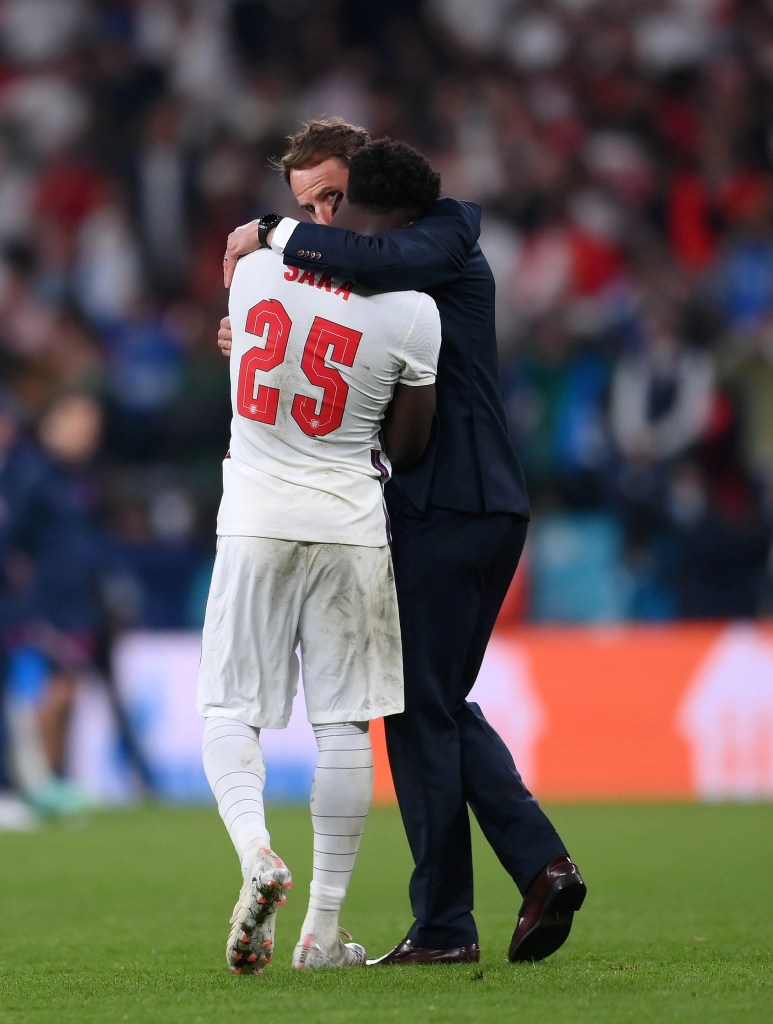 England boss Gareth Southgate consoles Bukayo Saka after his penalty miss in the final