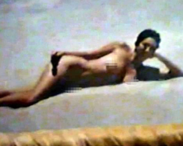 This photo, which appears to show Maxwell naked on a beach, was found in a 2005 raid