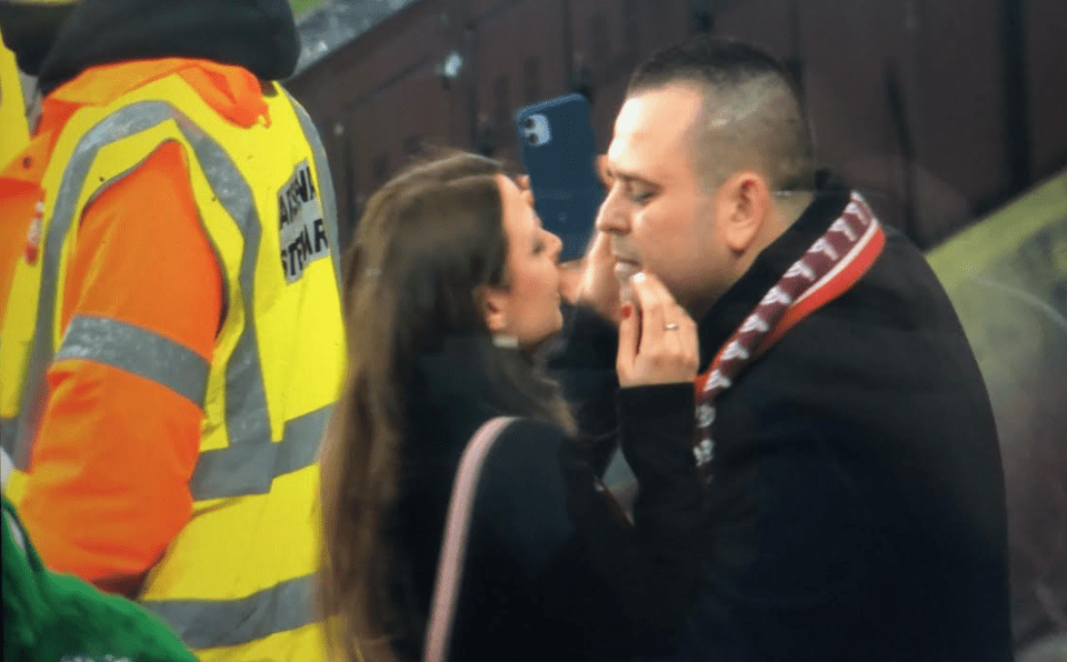 The newly-betrothed couple prepare to pucker up at the Emirates