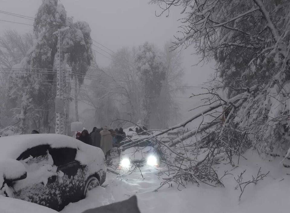 Video and pictures shared on social media showed cars packed bumper-to-bumper, with three foot piles of snow on their roofs