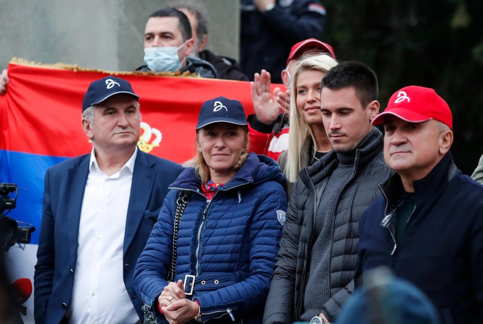 Dijana, the mother of Novak Djokovic, attends a rally in front of Serbia's National Assembly with his father and brother