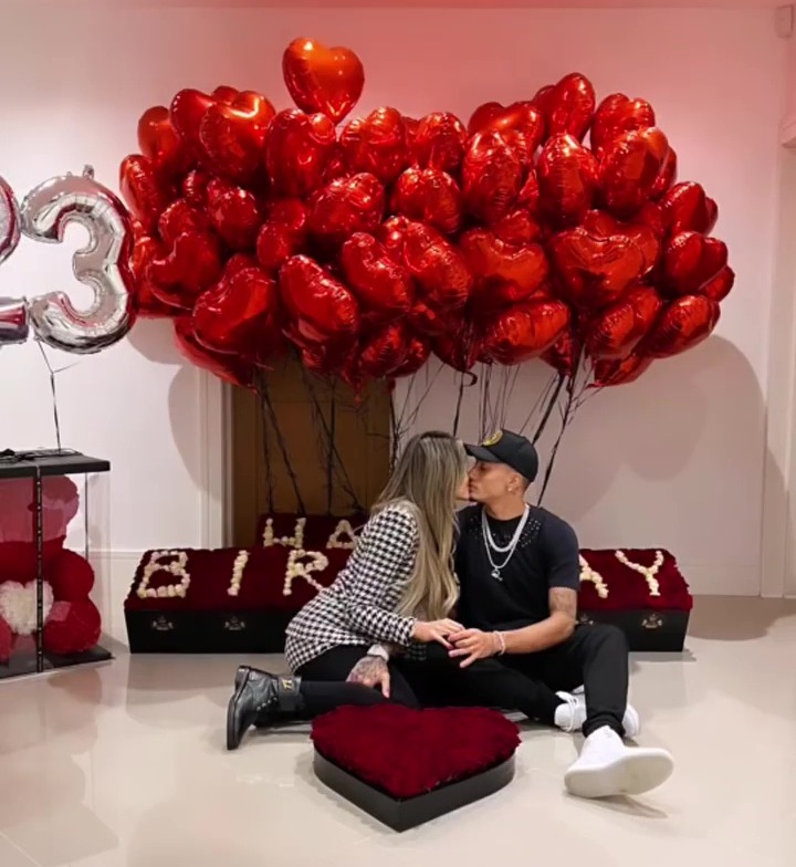 They also posed in front of the Happy Birthday sign