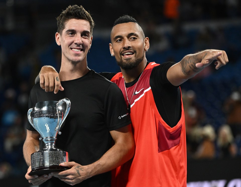 The pair posed with the trophy after sealing their maiden Grand Slam title