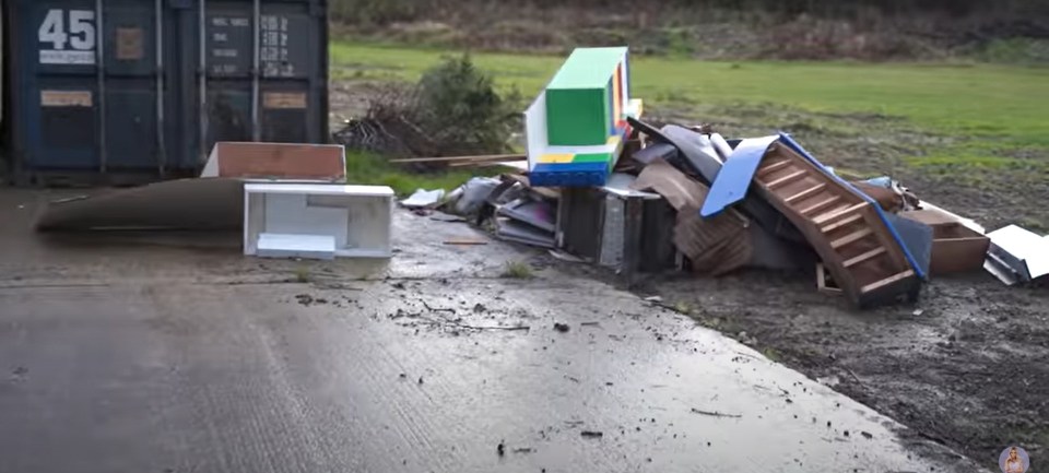 Katie showed off piles of rubbish and broken beds in the clip